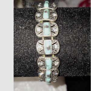 A Women's Stretch Bracelet Silver Tone Filigree Panel Faux Turquoise Rhinestone